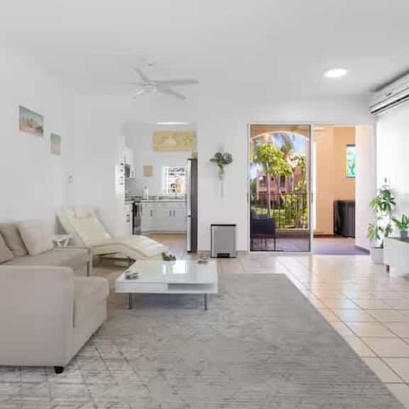 Modern Beach-Bound 2BR with Pool & Scenic Balcony - Image 1
